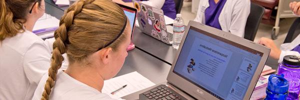 Nursing Student at computer in class